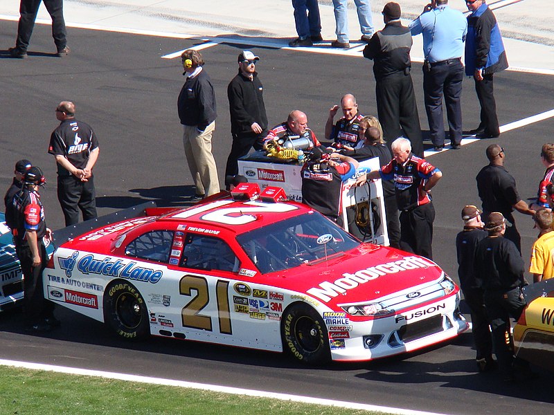 the tri-oval during the 2015 Daytona 500 with a nearly completed grandstand in the background