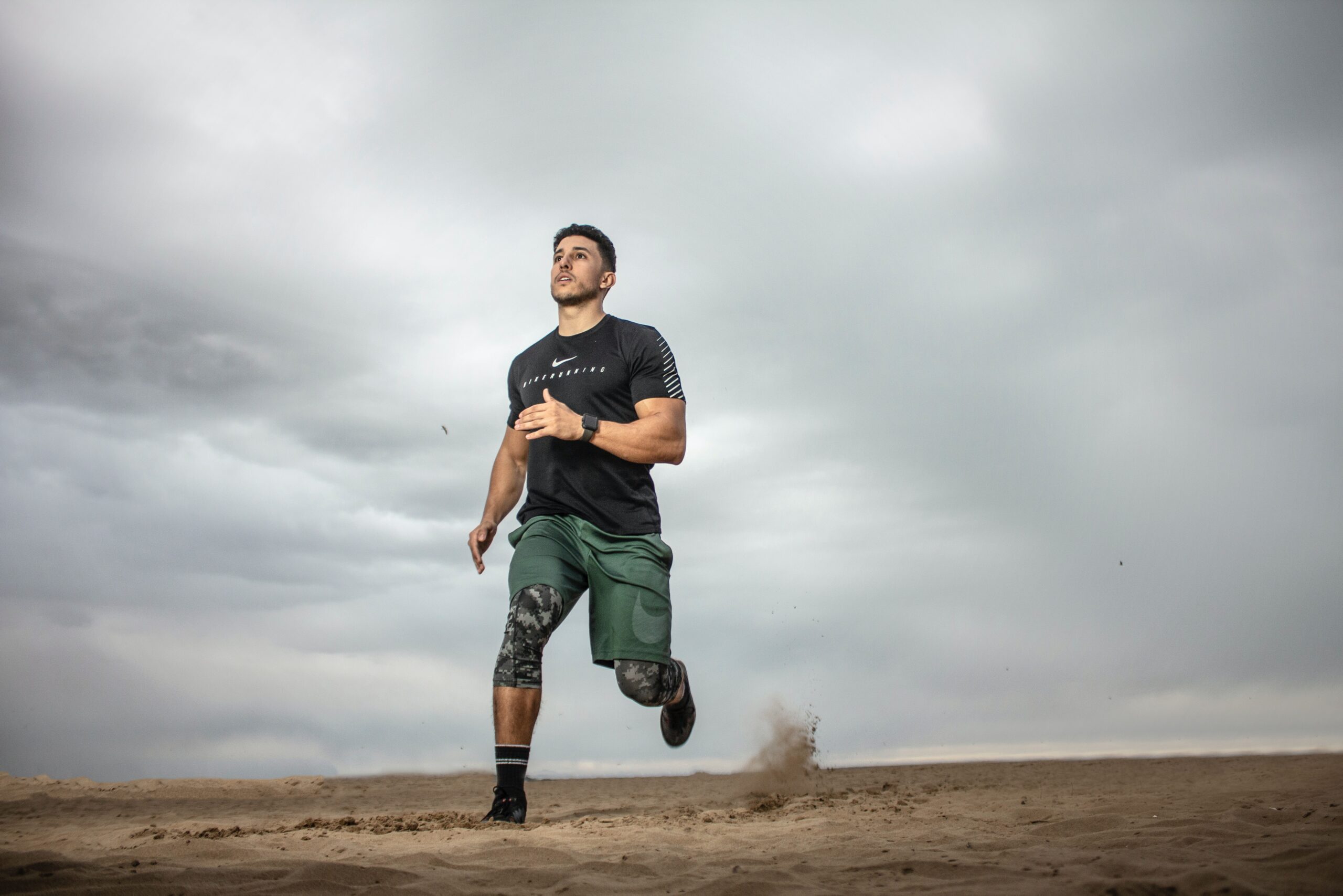 Man running on sad field
