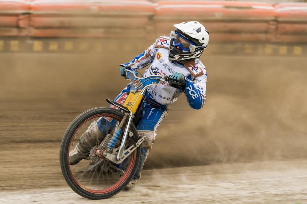 A BMX racer on a dusty track
