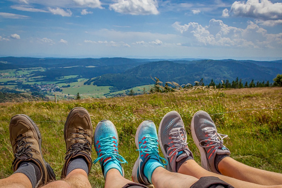 resting feet with different types of hiking shoes