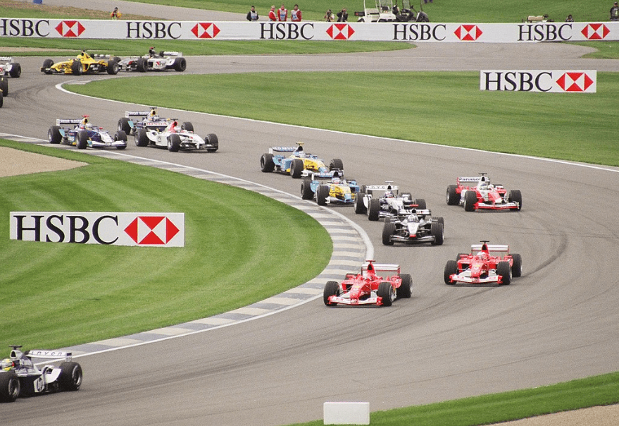 Formula One cars wind through the infield section of the Indianapolis Motor Speedway during the 2003 United States Grand Prix.