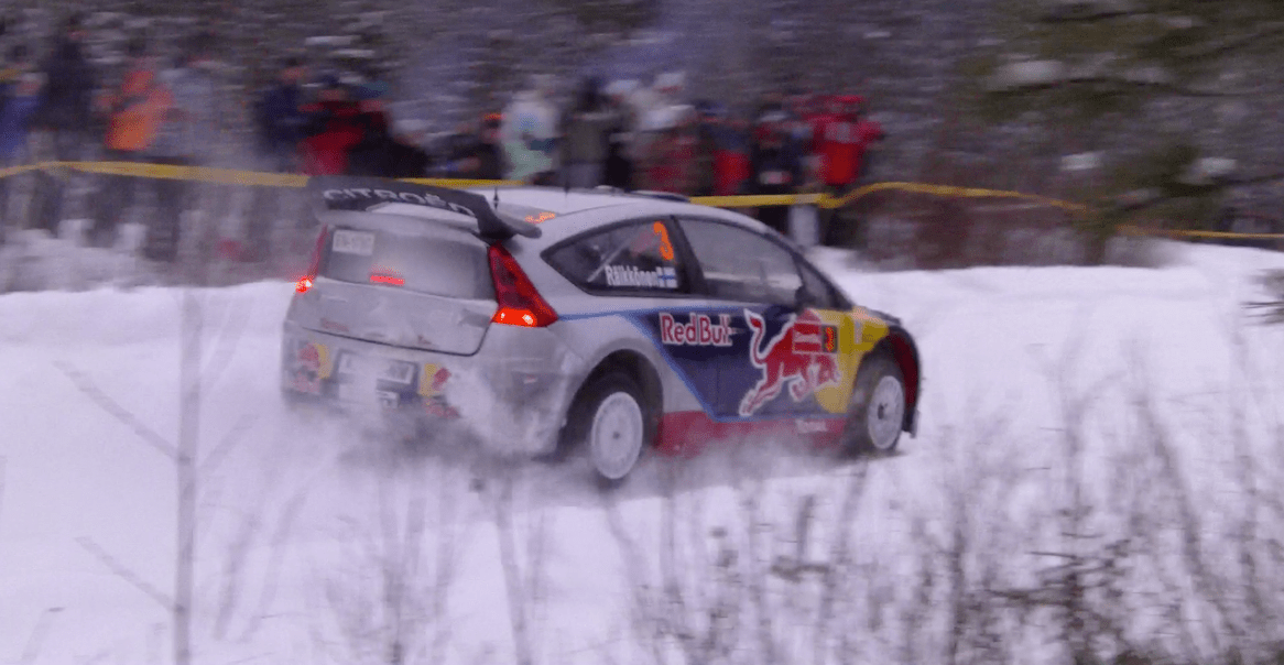 a rally car racing through the snowy tacks inside the Arctic Circle
