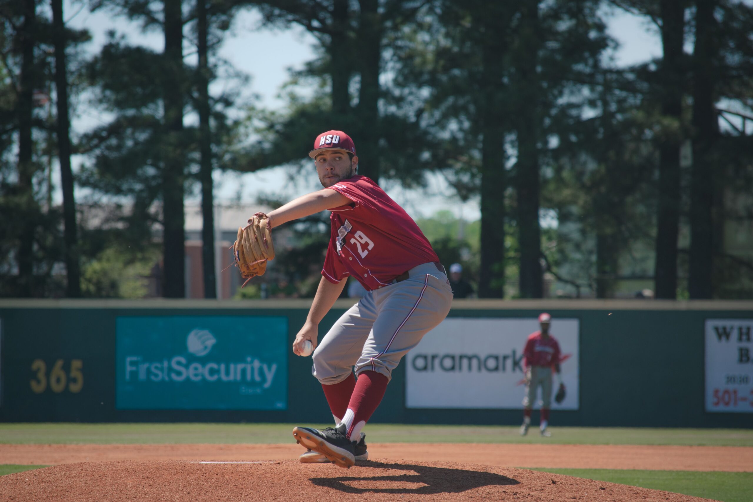 photo of a pitcher throwing a baseball