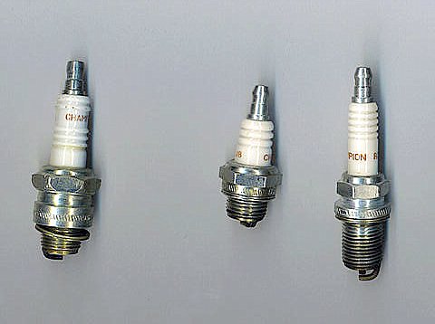 several sizes of spark plug (electrodes at the bottom)