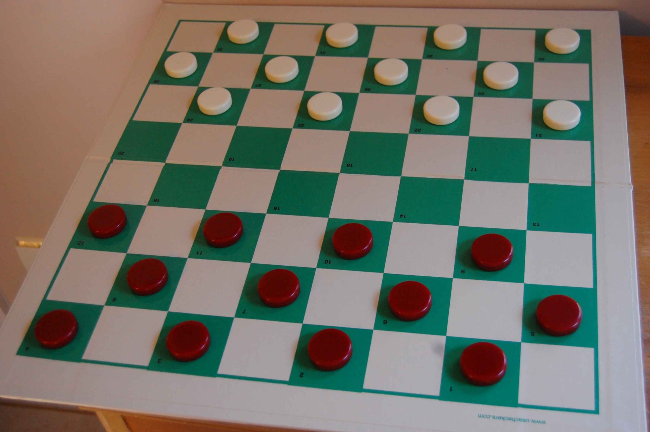 starting position for American checkers on an 8x8 checkerboard black(red) moves first